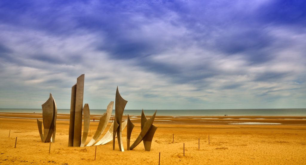 The monument Les Braves is located on the center of Omaha Beach.